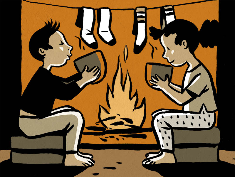Image d'enfants buvant un chocolat devant un feu de cheminée