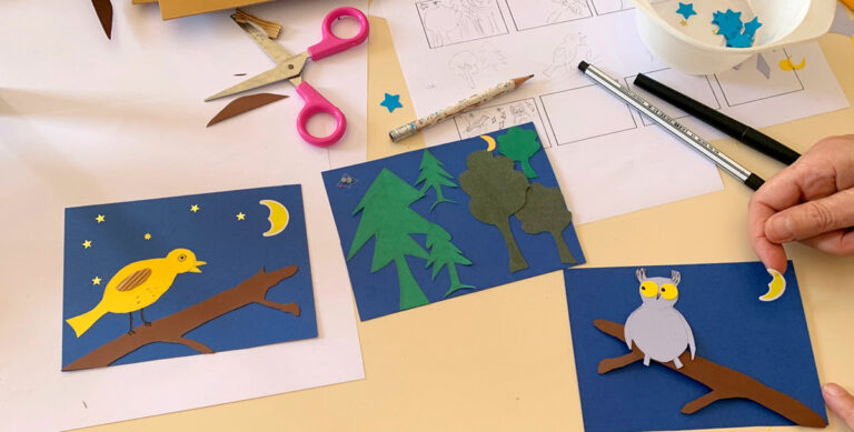 des mains créant des images en papier découpé